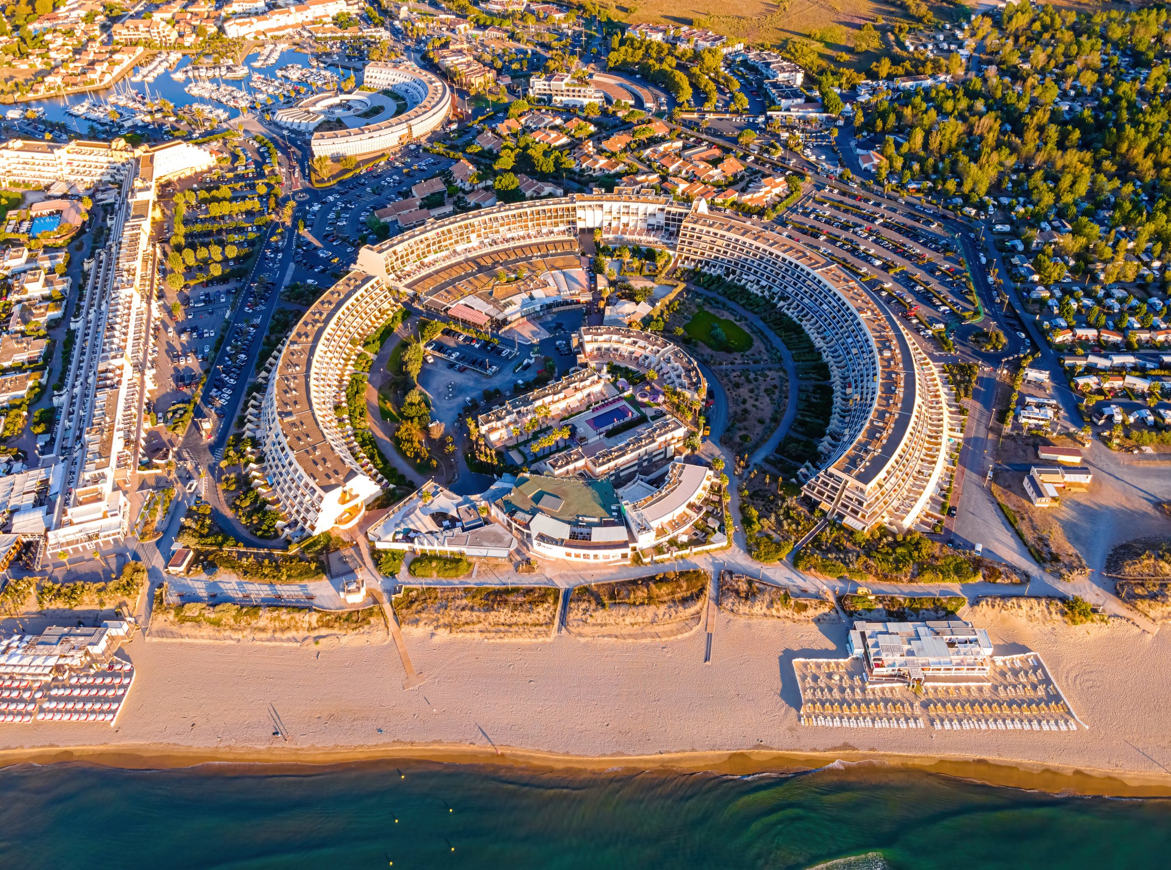 Aerial view of the Cap d'Agde Naturist Village at sunset